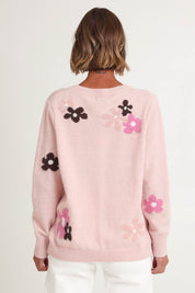 Model Riina wearing size S of the Chelsea Flower Knit in colour Blush (Pink), from the back