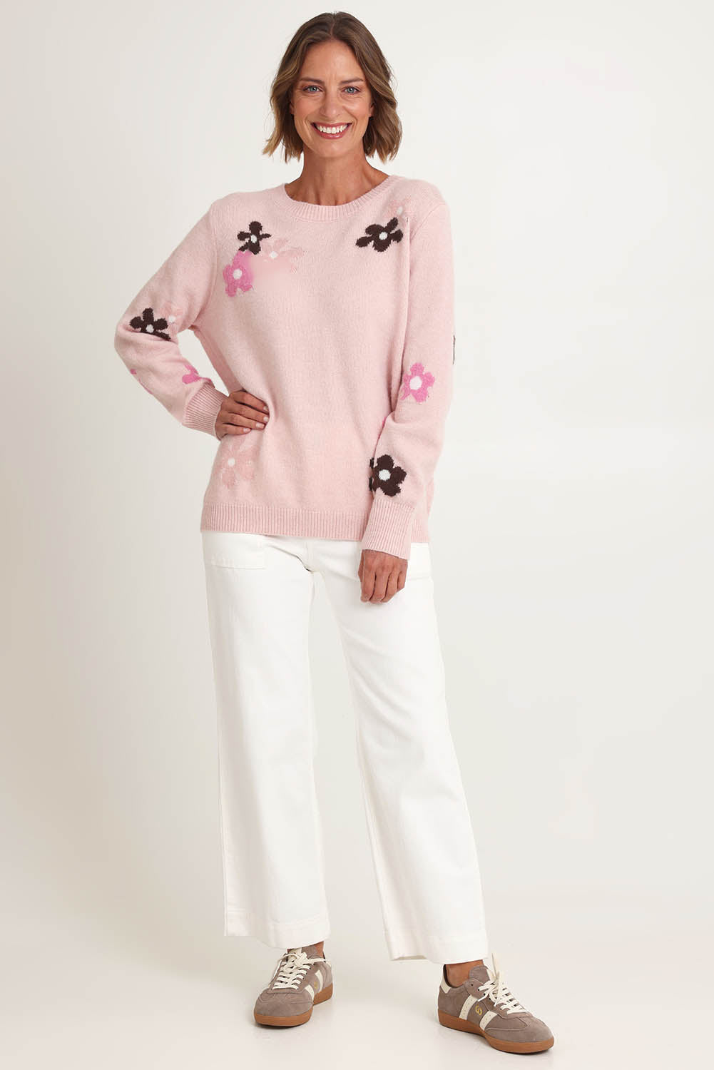 Model Riina wearing size S of the Chelsea Flower Knit in colour Blush (Pink), from the front, showing the whole outfit