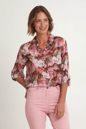 Model Riina wearing size 10 of the Dakota Print Shirt in colour Blush (Pink), from the front, cropped image