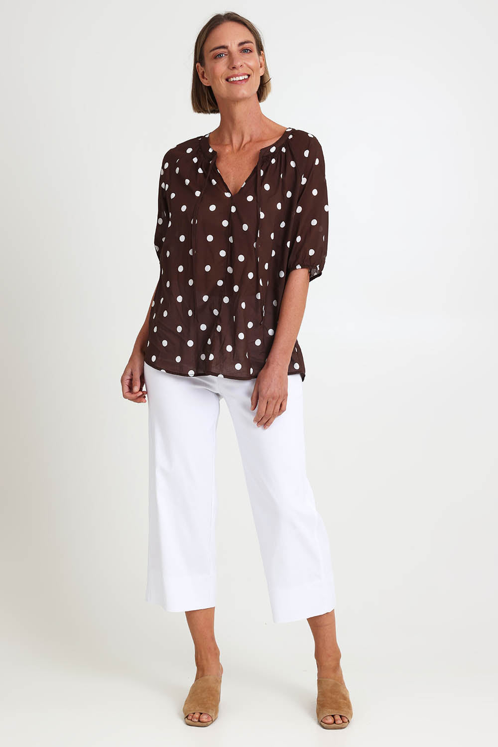 Model Riinar wearing size 10 of the Riviera Spot Top – Coffee in colour Coffee, from the front