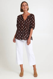 Model Riinar wearing size 10 of the Riviera Spot Top – Coffee in colour Coffee, from the front