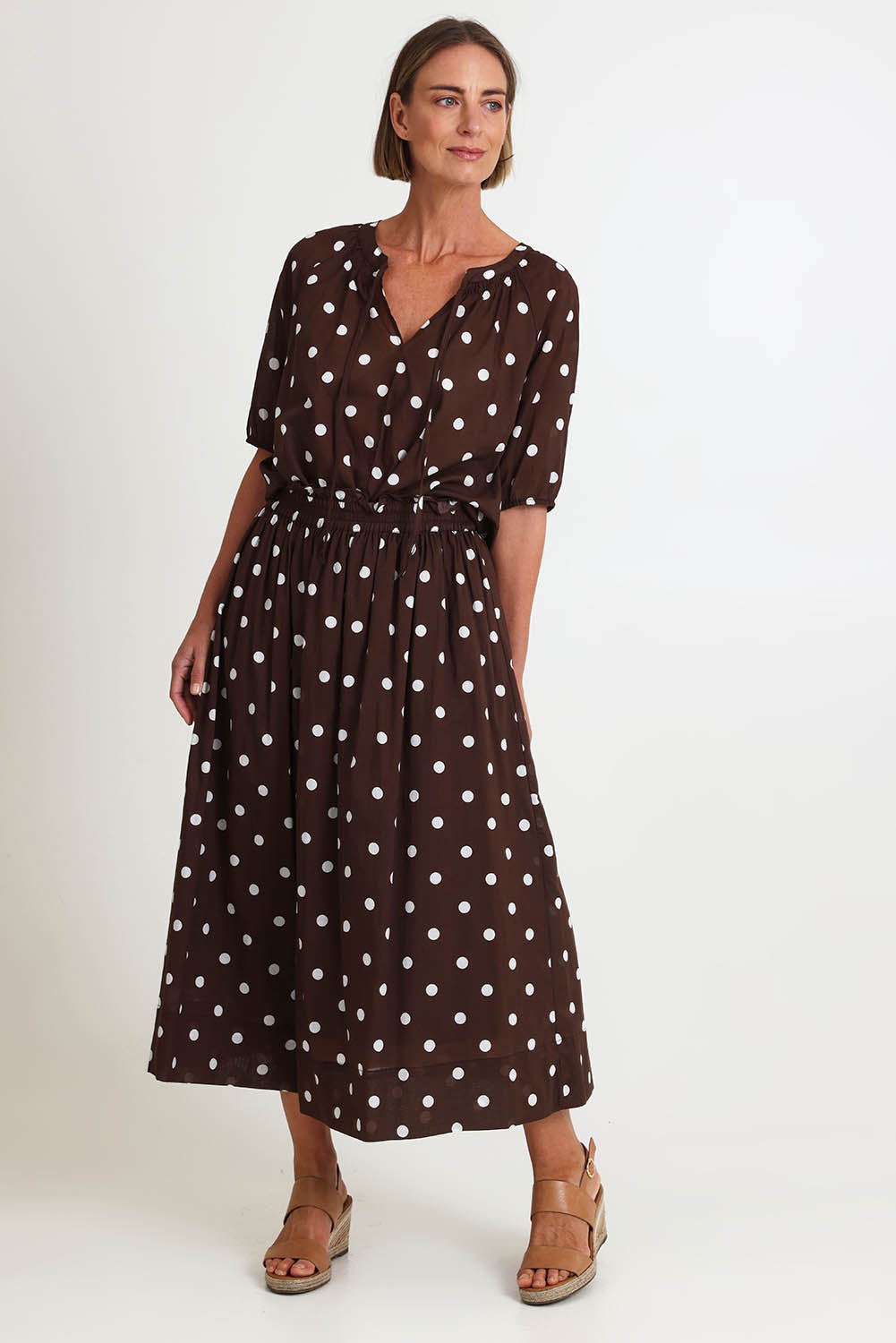 Model Riinar wearing size 10 of the Riviera Spot Skirt – Coffee in colour Coffee, from the front