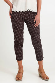 Model Riinar wearing size 10 of the Shell Print Pant – Mocha in colour Mocha, in a cropped view