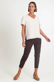 Model Riinar wearing size 10 of the Shell Print Pant – Mocha in colour Mocha, from the front