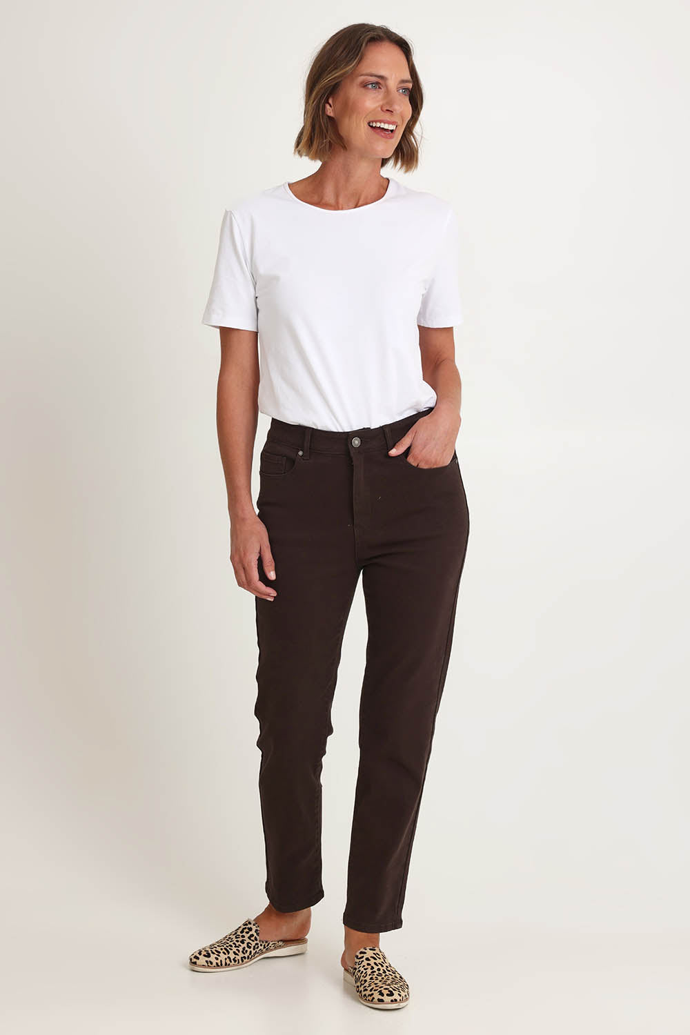 Model Riina wearing size 10 of the Slim Miracle Denim Jeans in colour Coffee, from the front, showing the whole outfit