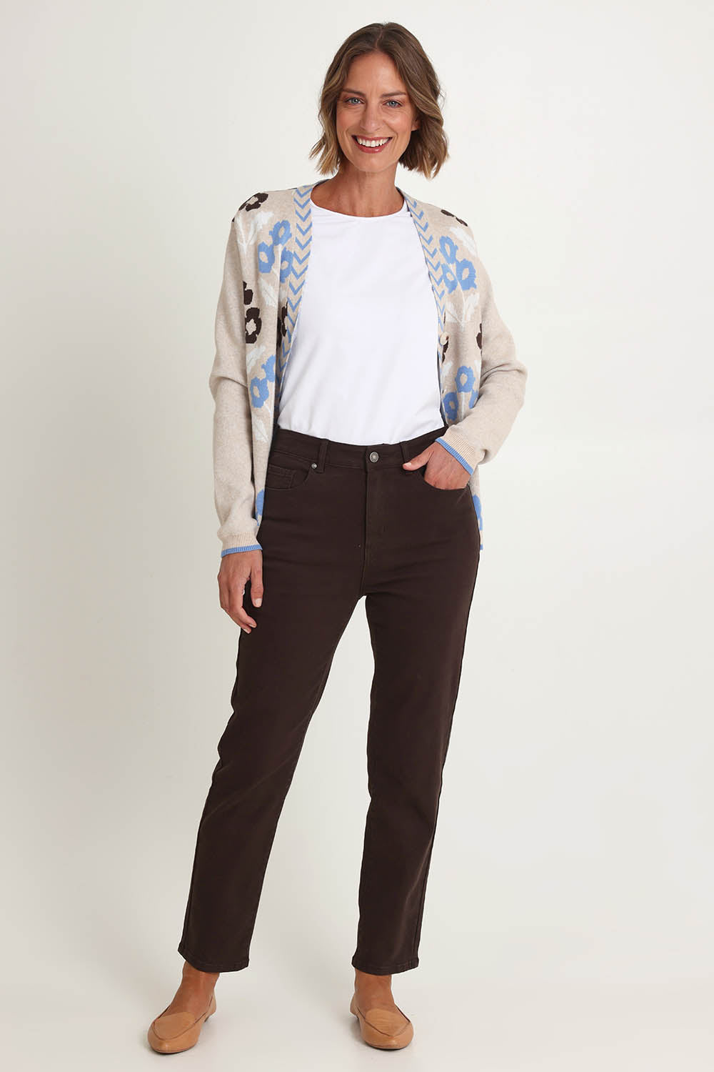 Model Riina wearing size 10 of the Slim Miracle Denim Jeans in colour Coffee, from the front, showing the whole outfit