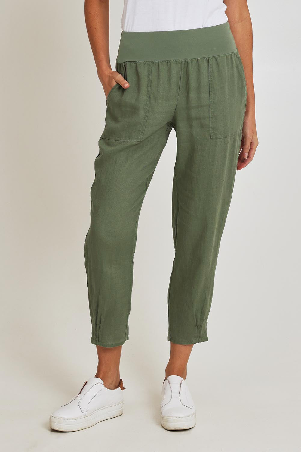Model Madeline wearing size 10 of the Pull On Linen Pant in colour Khaki (Green), from the front, cropped image