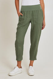 Model Madeline wearing size 10 of the Pull On Linen Pant in colour Khaki (Green), from the front, cropped image