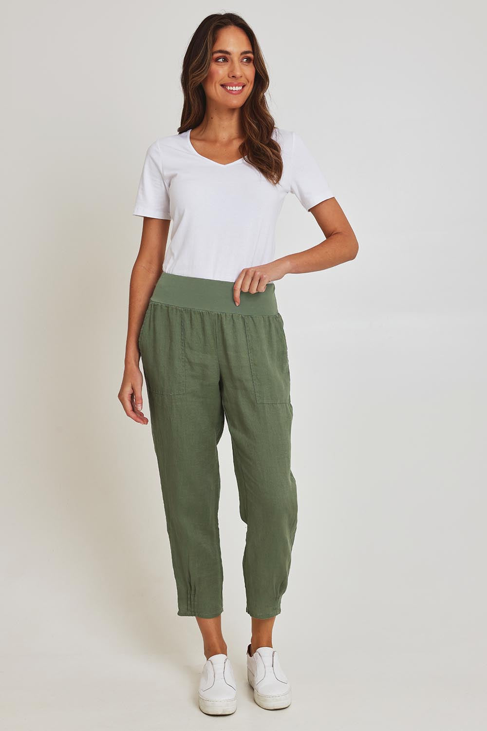 Model Madeline wearing size 10 of the Pull On Linen Pant in colour Khaki (Green), from the front, showing the whole outfit