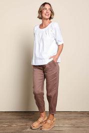 Model Riinar wearing size 10 of the Pull On Linen Pant - Mocha in colour Mocha, from the front