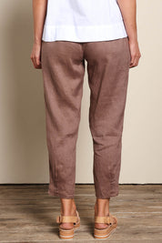 Model Riinar wearing size 10 of the Pull On Linen Pant - Mocha in colour Mocha, from the front