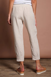 Model Madeline wearing size 10 of the Pull On Linen Pant in colour Natural, from the back