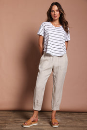 Model Madeline wearing size 10 of the Pull On Linen Pant in colour Natural, from the front, showing the whole outfit