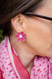 Model Genericm wearing size sample of the Bronte Flower Stud Earring - Darkpink in colour Darkpink, from an angle