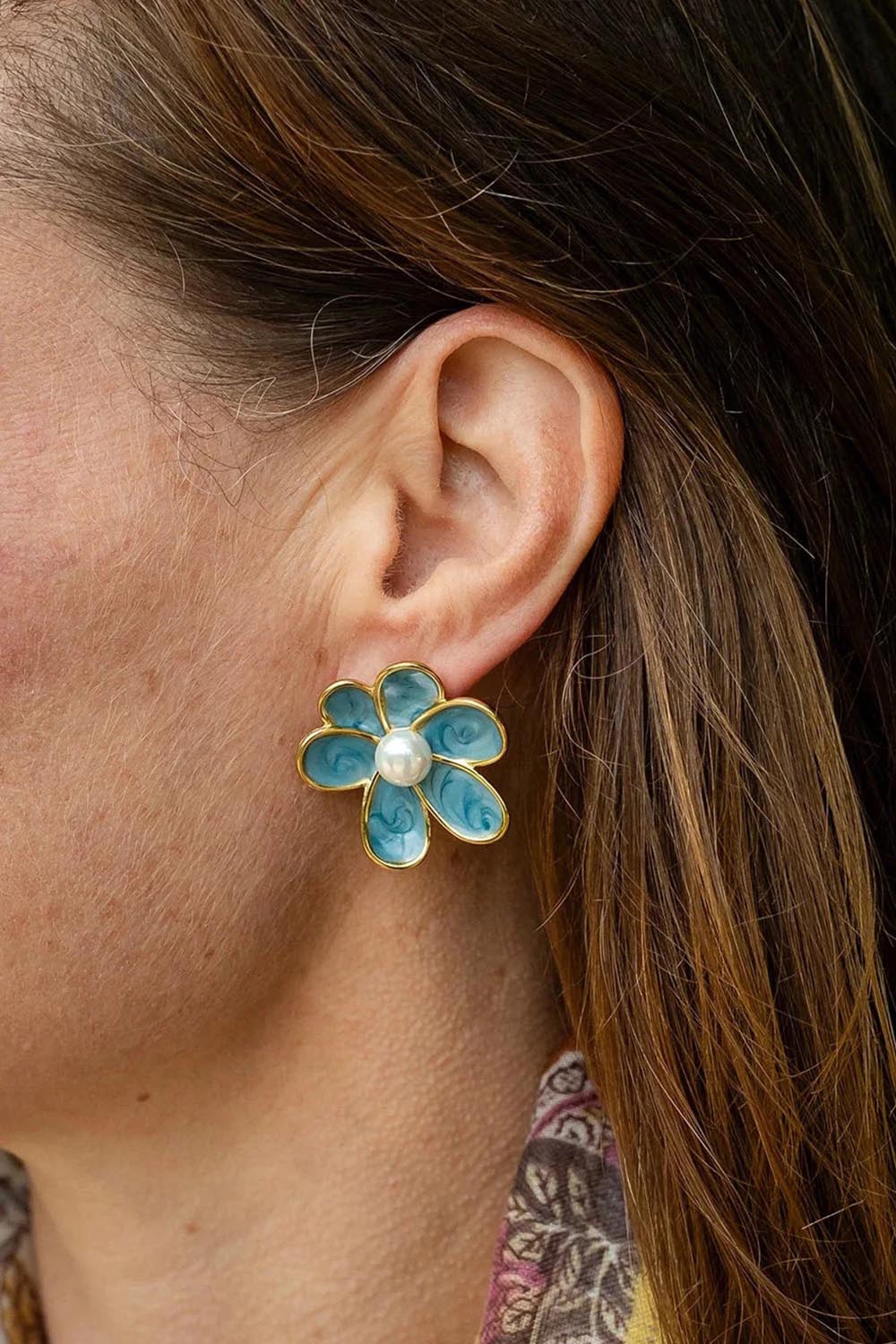 Model Genericm wearing size sample of the Bronte Flower Stud Earring - Teal in colour Teal, from an angle