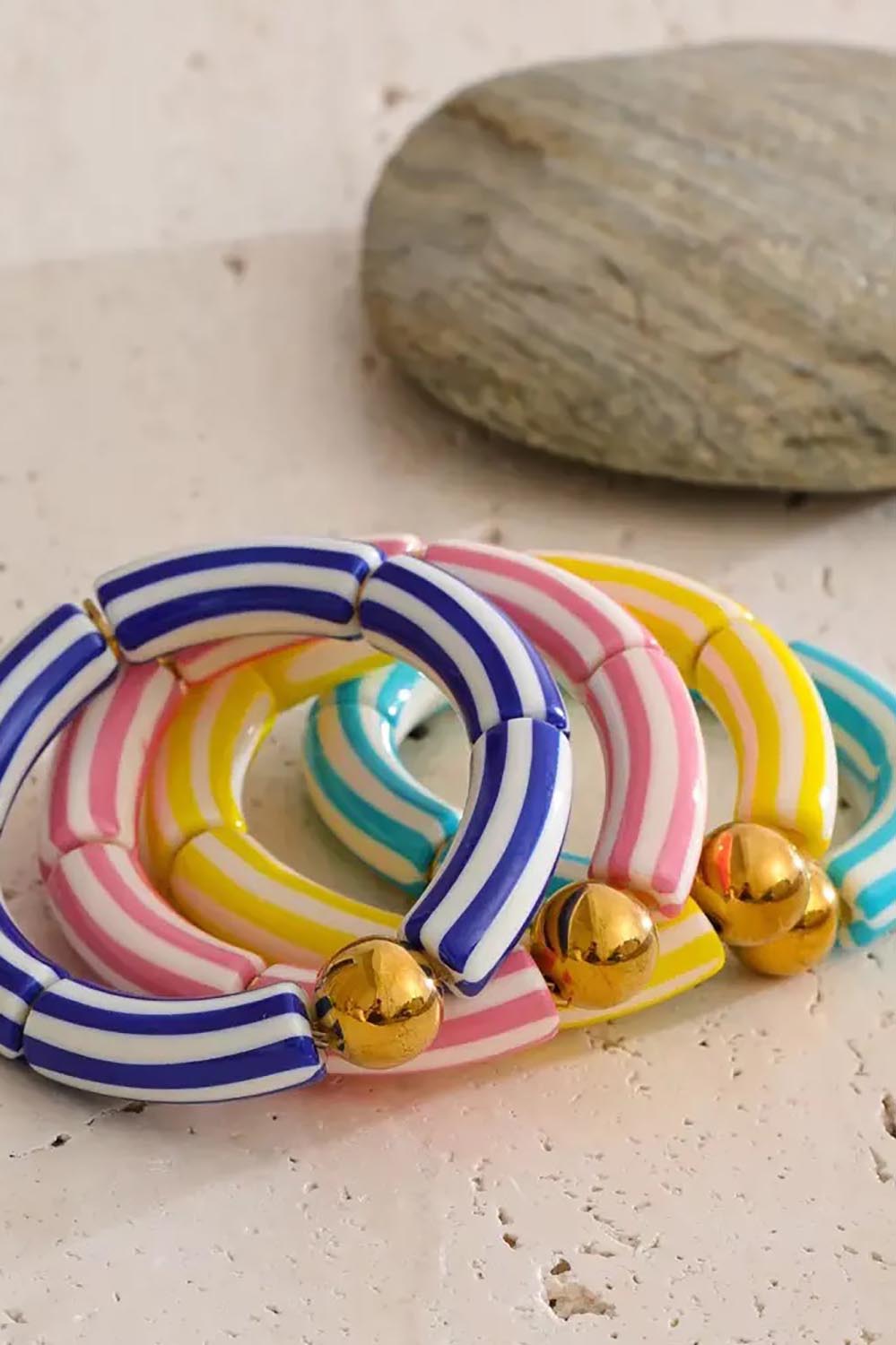 Product shot of the Candy Stripe Stretch Bracelet - Yellow in colour Yellow, from the back