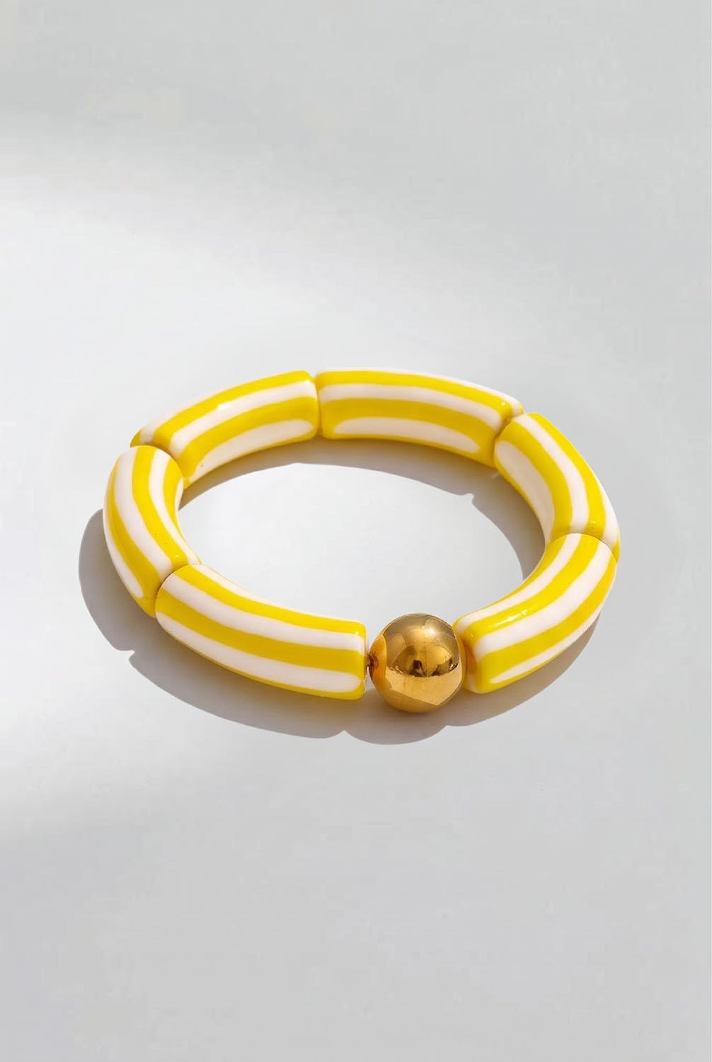 Product shot of the Candy Stripe Stretch Bracelet - Yellow in colour Yellow, from the front