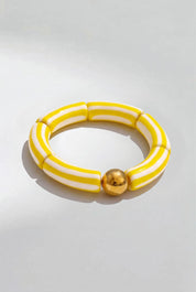 Product shot of the Candy Stripe Stretch Bracelet - Yellow in colour Yellow, from the front