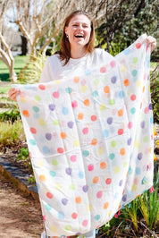 A model wearing the Darcy Spot Lightweight Scarf in colour Darcyspot, from the front, showing the whole outfit