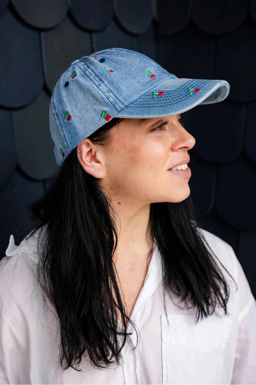 Model Genericm wearing size sample of the Embroidered Cap - Cherrymid in colour Cherrymid, from an angle