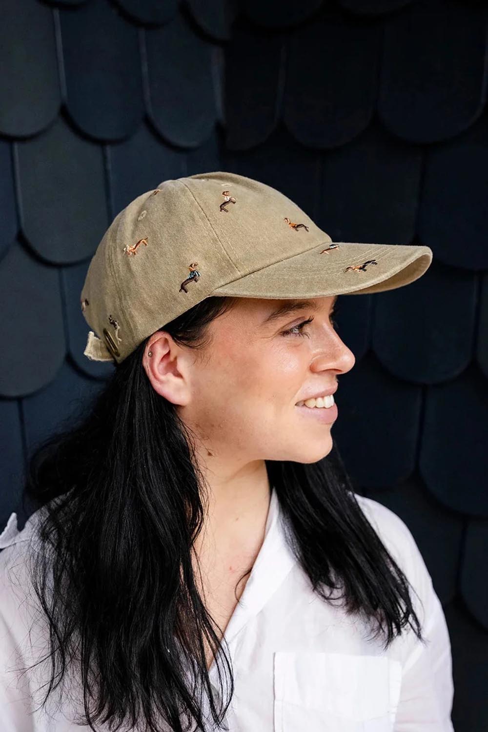 Model Genericm wearing size sample of the Embroidered Cap - Dacshundbeige in colour Dacshundbeige, from an angle