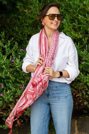Model Genericm wearing size sample of the Erin Floral Lightweight Scarf - Pinkred in colour Pinkred, from an angle