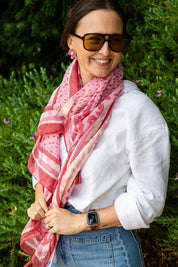 Model Genericm wearing size sample of the Erin Floral Lightweight Scarf - Pinkred in colour Pinkred, from an angle