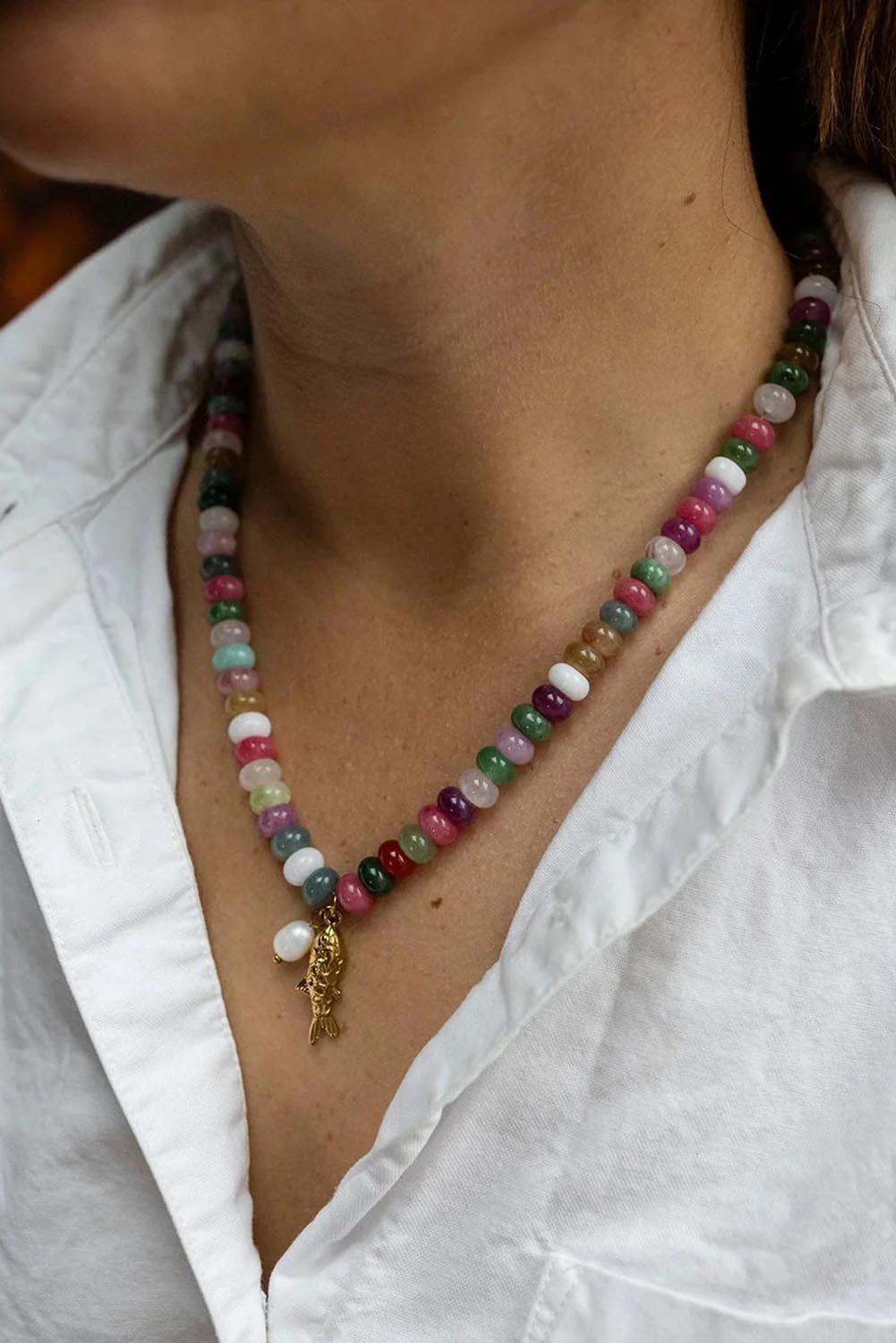 Model Genericm wearing size sample of the Fish & Pearl Necklace - Pastels in colour Pastels, in a cropped view