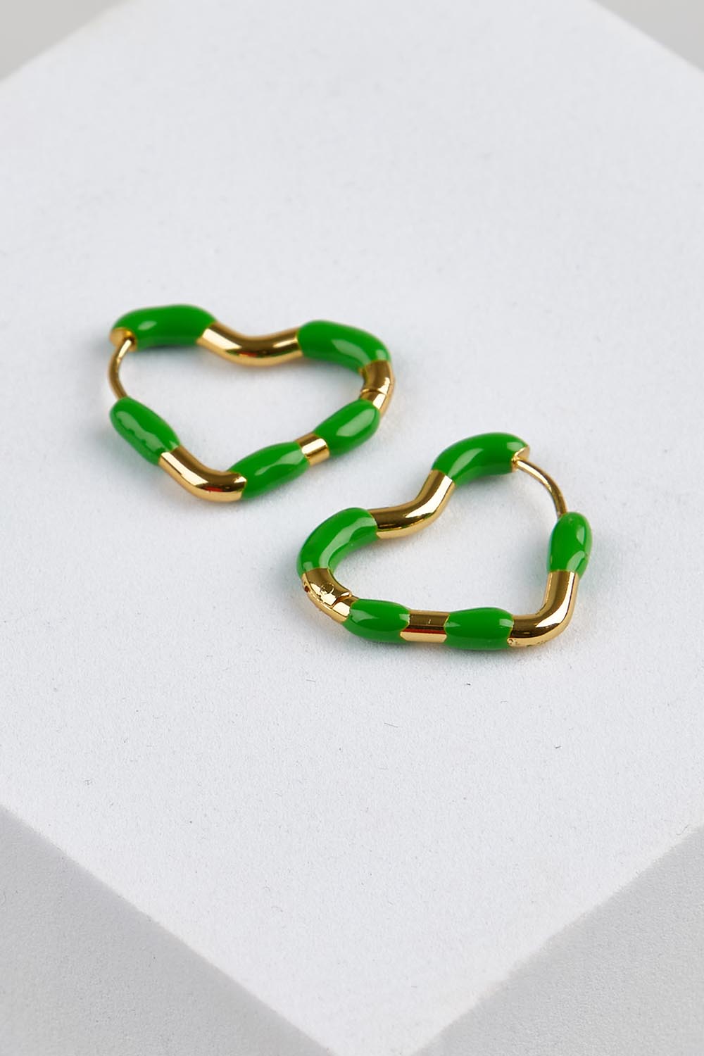 Model Genericm wearing size sample of the Hannah Heart Hoop Earring - Emeraldgreen in colour Emeraldgreen, in a cropped view