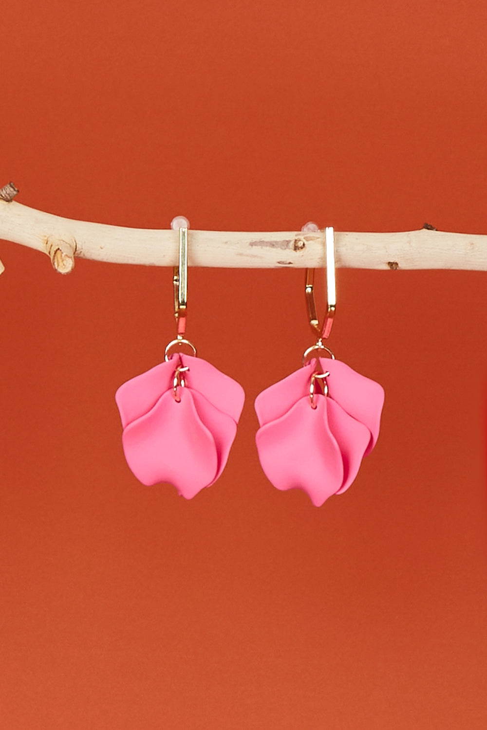 A model wearing size OneSize of the Medium Drop Multi Leaf Earring in colour Pink (Pink), from the front, showing the whole outfit