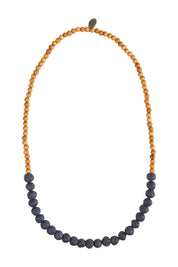 Product shot of the Mini Wood & Rock Necklace in colour Navy (Blue), from the front