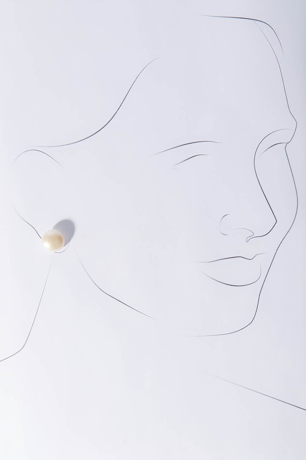 A model wearing size OneSize of the Sterling Silver Large Pearl Stud in colour Silver (White), from the front, showing the whole outfit