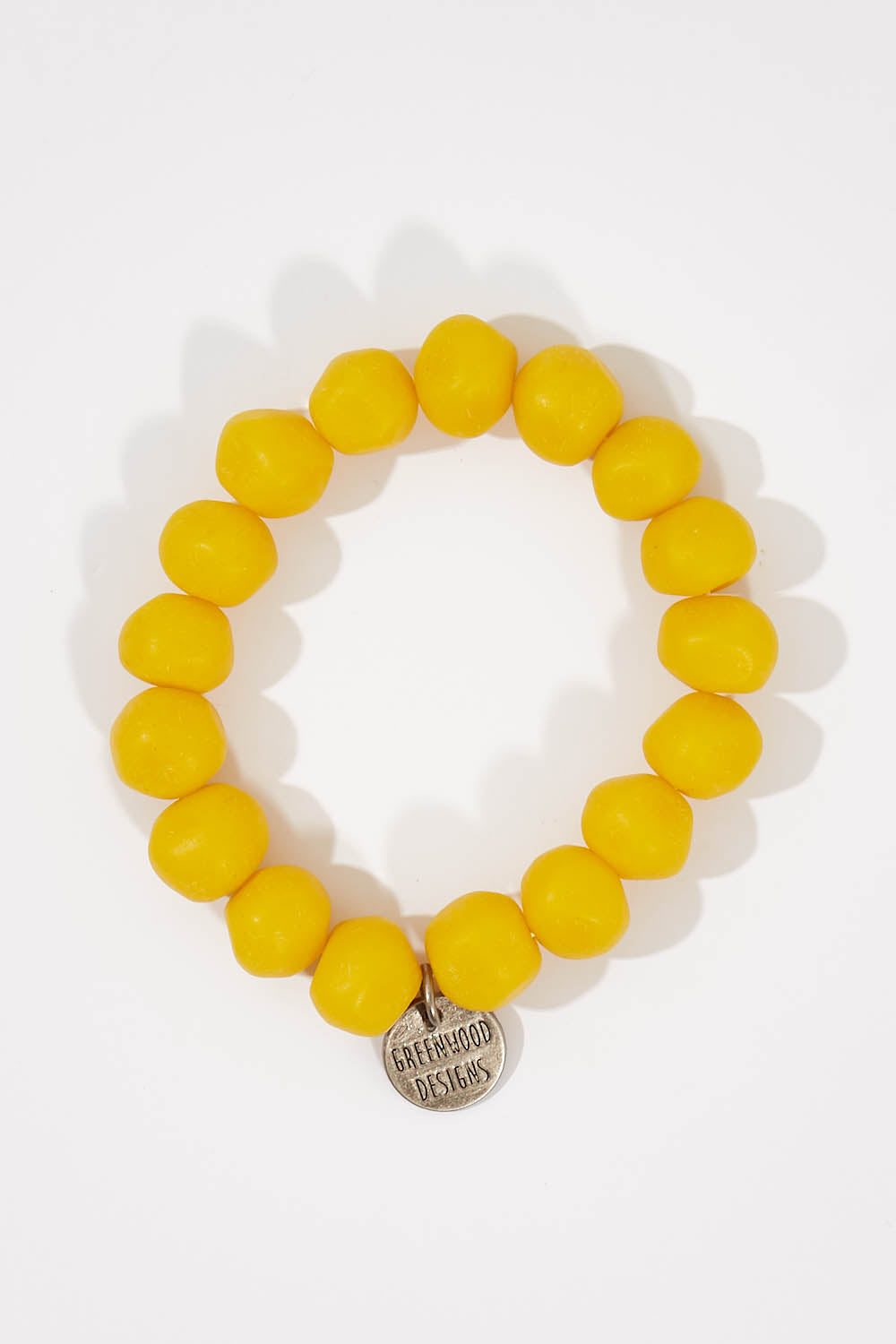 A model wearing size OneSize of the Rock Resin Bracelet in colour Yellow, from the front, showing the whole outfit
