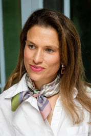 Model Genericm wearing size sample of the Silk Neck Scarf  - Vienna in colour Vienna, from an angle