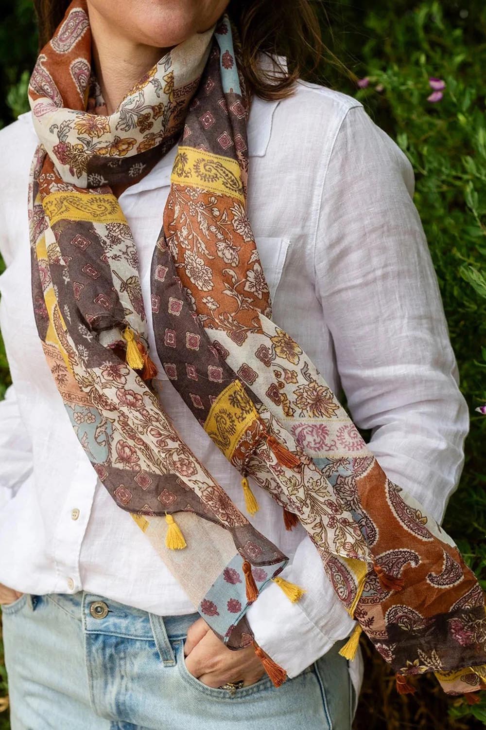 Model Genericm wearing size sample of the Tara Patchwork Lightweight Scarf - Patchwork in colour Patchwork, in a cropped view