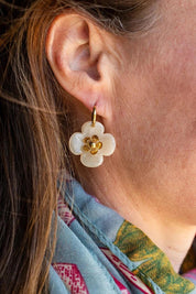 Model Genericm wearing size sample of the Willa Flower Hoop Earring - Cream in colour Cream, from an angle