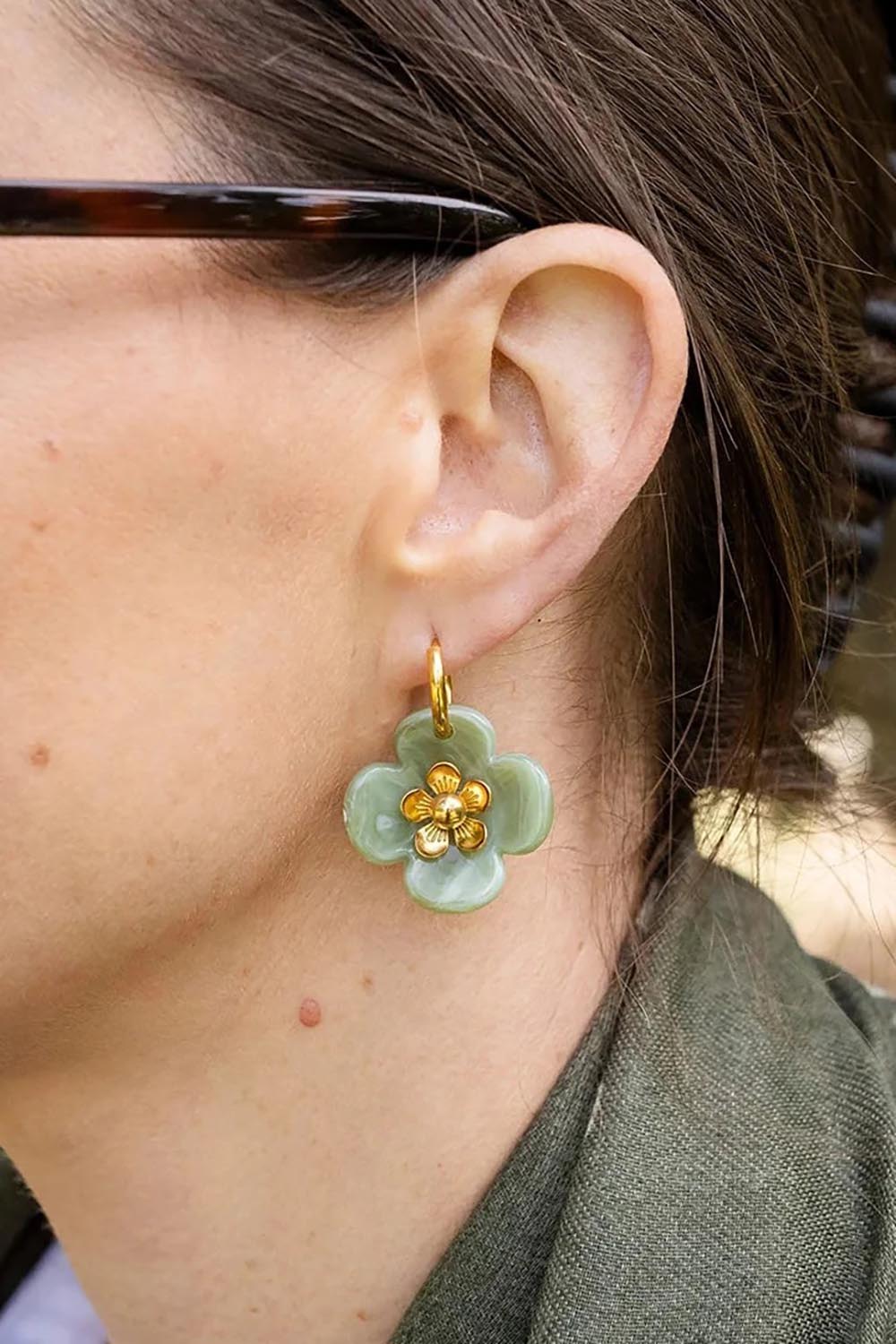 Model Genericm wearing size sample of the Willa Flower Hoop Earring - Green in colour Green, from an angle
