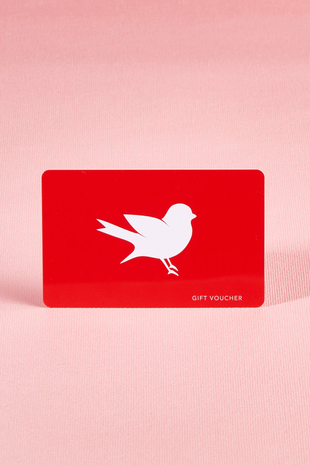 A model wearing the $750 Gift Voucher in colour Red (undefined), from the front, showing the whole outfit