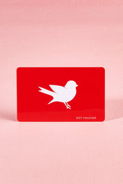 A model wearing the $750 Gift Voucher in colour Red (undefined), from the front, showing the whole outfit