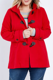 Model Jess wearing size 14 of the Duffle Jacket in colour Red (Red), from the front, cropped image