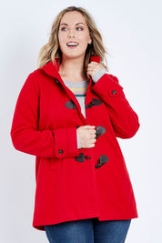 Model Jess wearing size 14 of the Duffle Jacket in colour Red (Red), from the front, cropped image