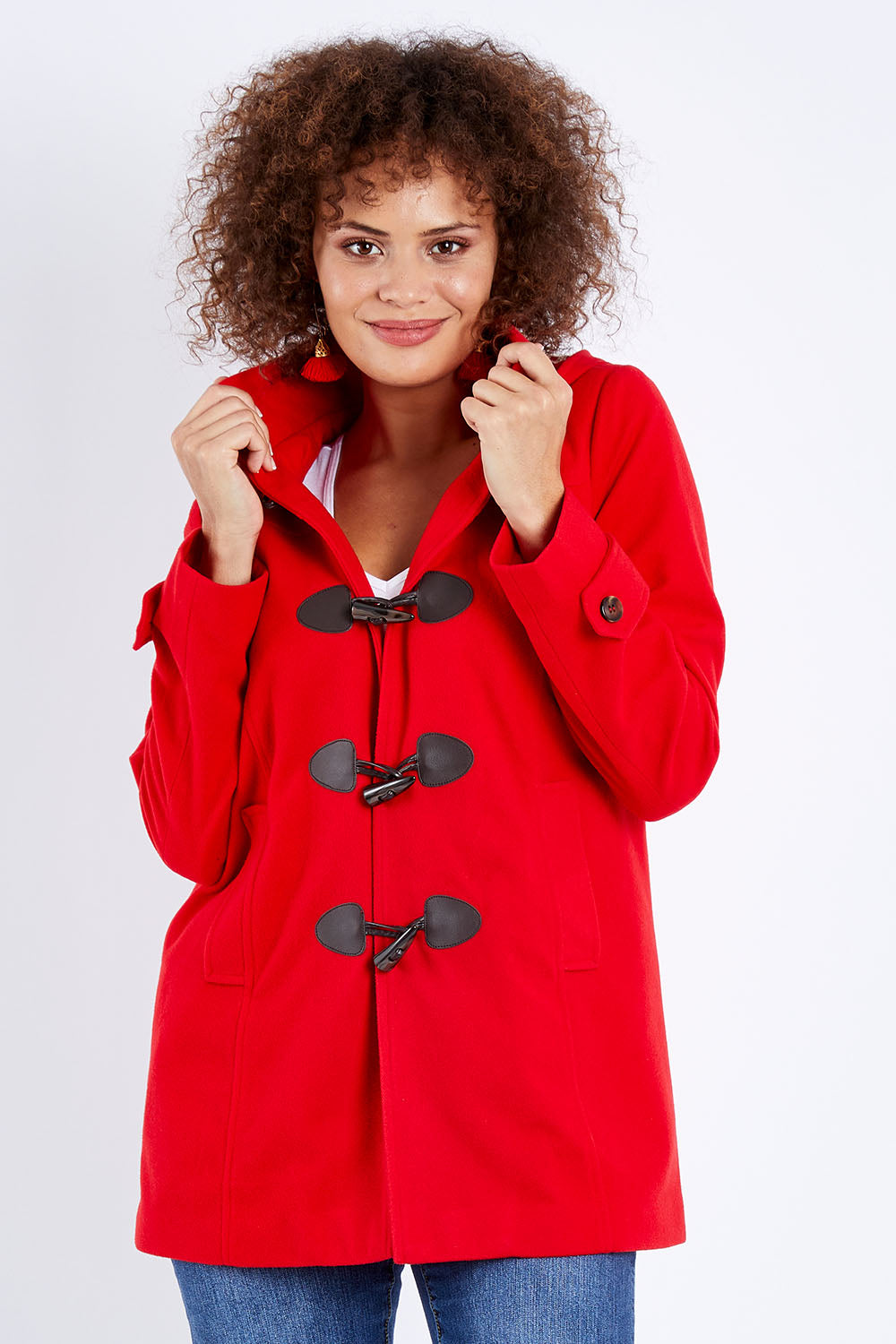 Model Lala wearing size 10 of the Duffle Jacket in colour Red (Red), from the front, cropped image