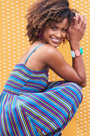 Model Narrah wearing size 10 of the Shirred Bodice Dress in colour Evrystripe (Blue), from the front, showing the whole outfit