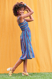 Model Narrah wearing size 10 of the Shirred Bodice Dress in colour Evrystripe (Blue), from the front, showing the whole outfit