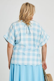Model Keeara wearing size 16 of the Gingham Top in colour Gingham (Blue), from the back