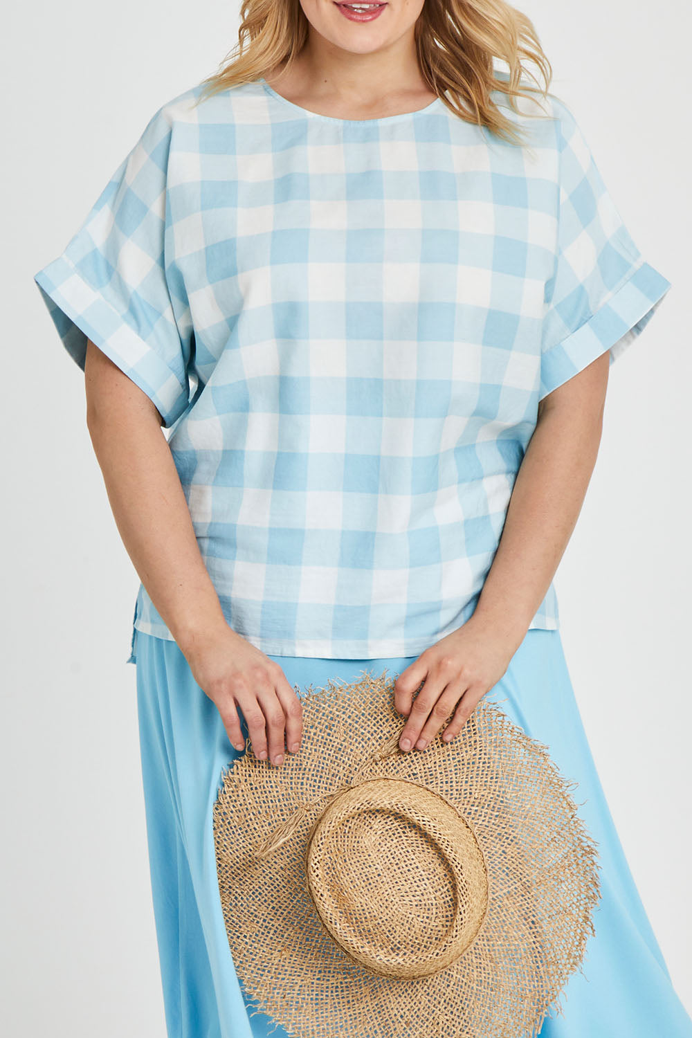 Model Keeara wearing size 16 of the Gingham Top in colour Gingham (Blue), from the front, cropped image