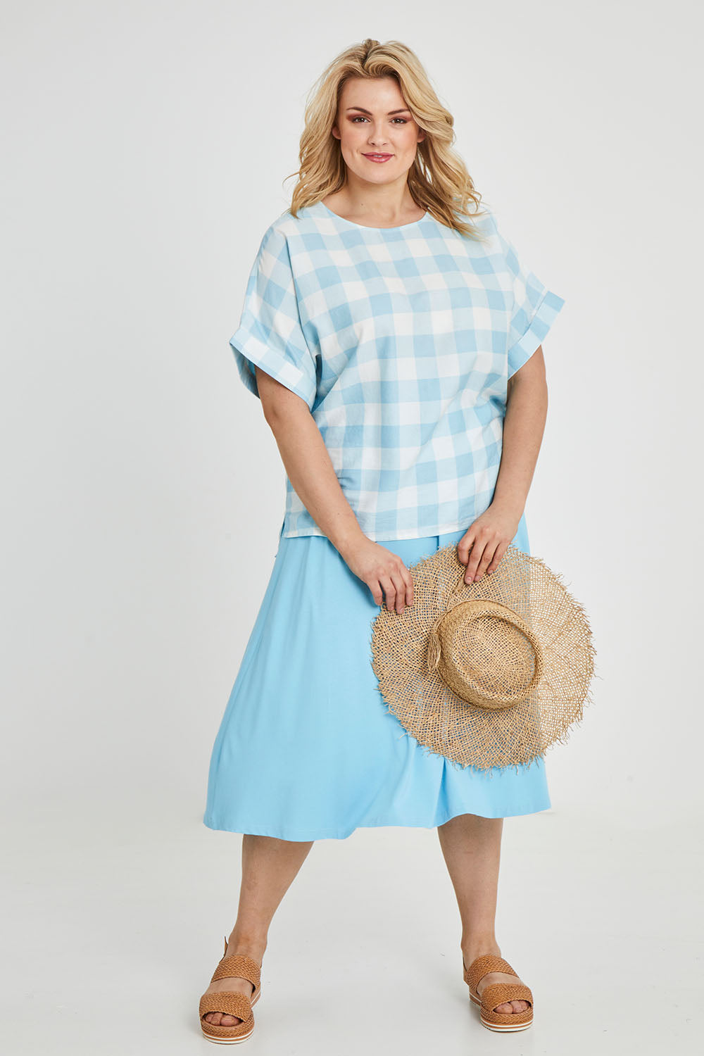 Model Keeara wearing size 16 of the Gingham Top in colour Gingham (Blue), from the front, showing the whole outfit