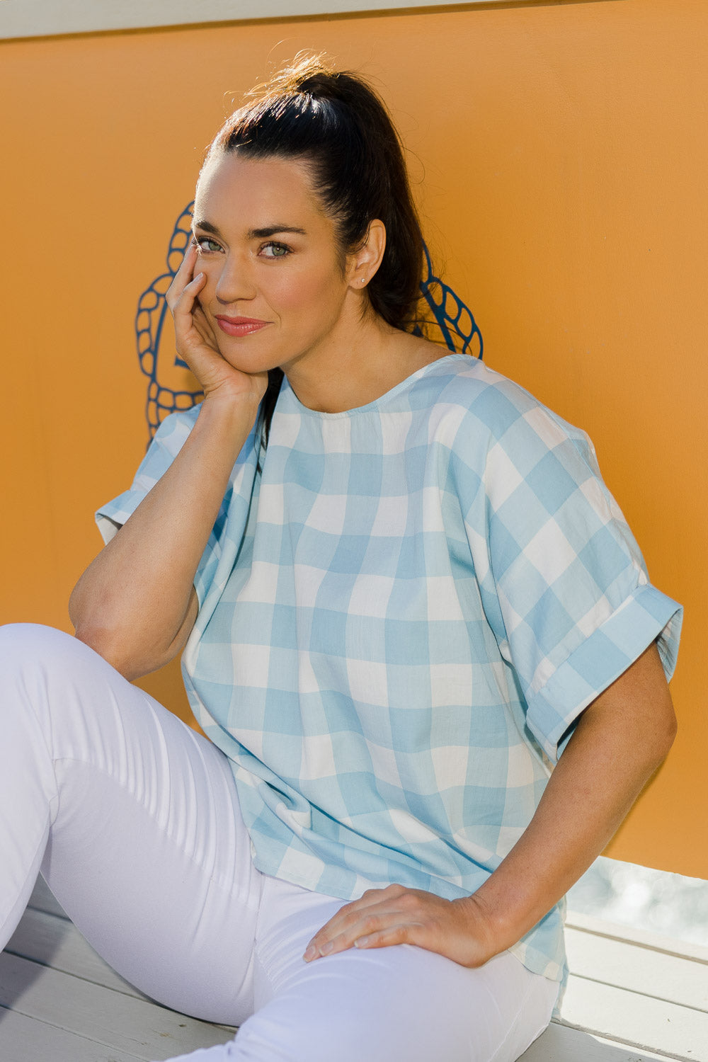 Model Laura wearing size 14 of the Gingham Top in colour Gingham (Blue), from the front, showing the whole outfit