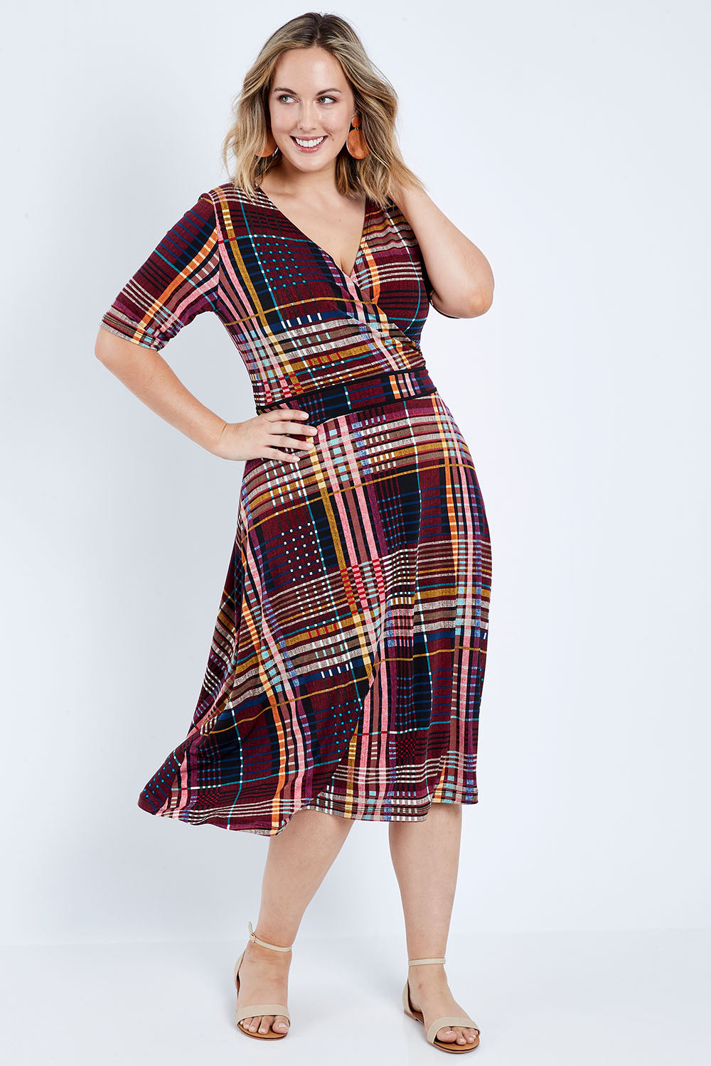Model Jess wearing size 14 of the Printed Short Sleeve Faux Wrap Dress in colour Checked (Black), from the front, showing the whole outfit