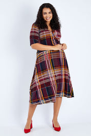 Model Sasha-Lee wearing size 16 of the Printed Short Sleeve Faux Wrap Dress in colour Checked (Black), from the front, showing the whole outfit